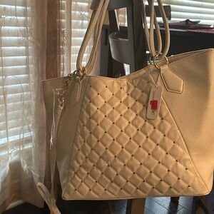 Charming Charlie… Gold studded ivory purse